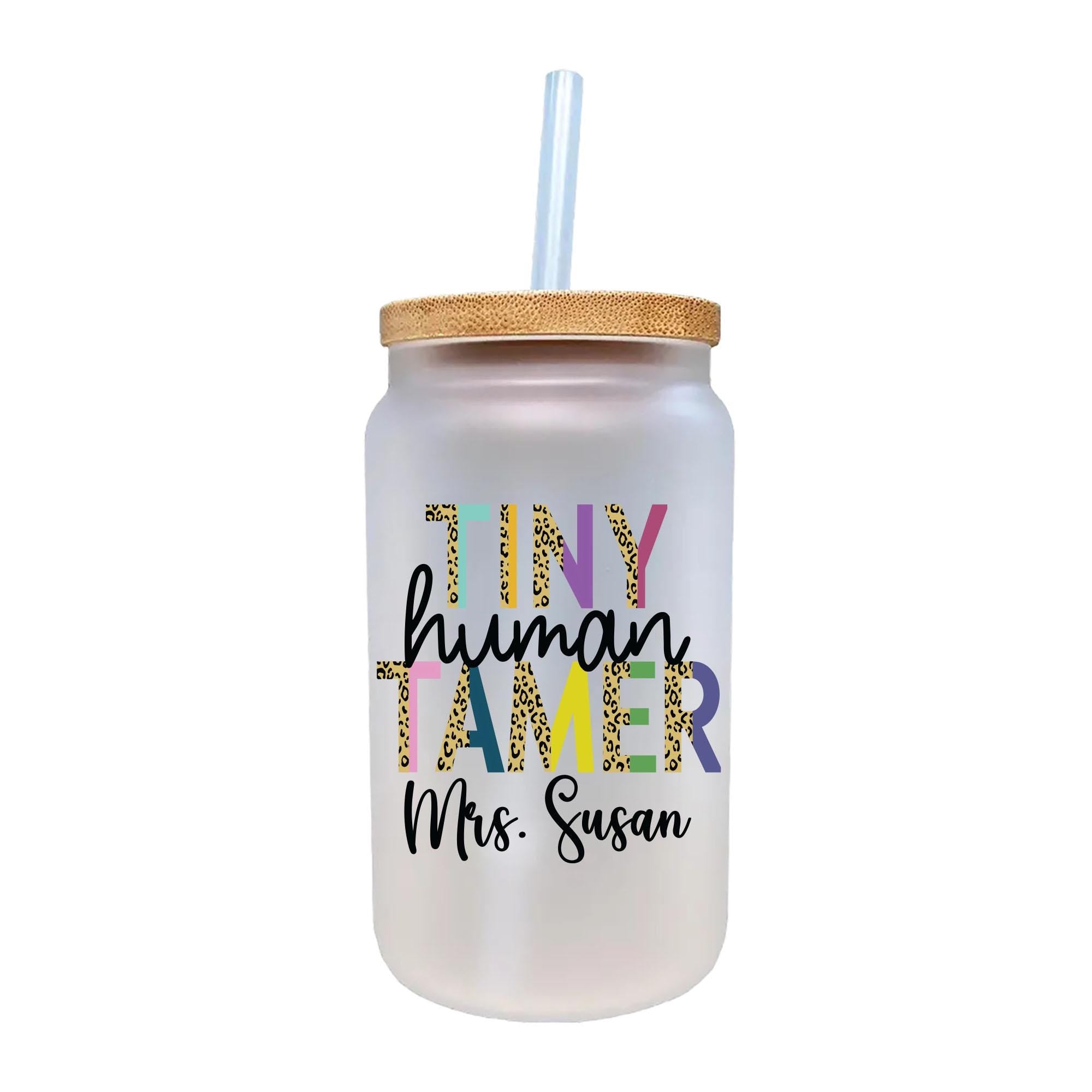 a white glass with a straw in it