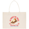 A beige tote bag with a graphic design featuring a loaf of bread and the text "In Crust We Trust" and "Tourdough Life Starter Flour Salt Water".