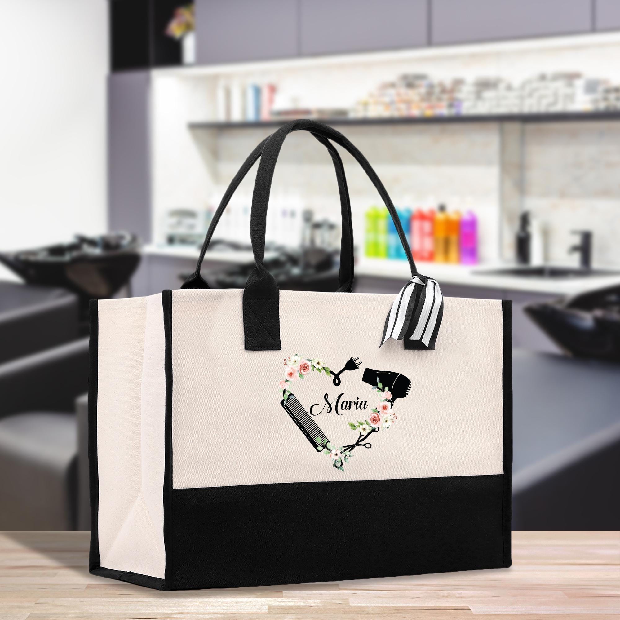 a black and white shopping bag with a picture of a wine glass