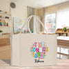 A white tote bag with a colorful, hand-drawn design featuring the text "I love my mommy/momma" and the name "Recca" printed on it.