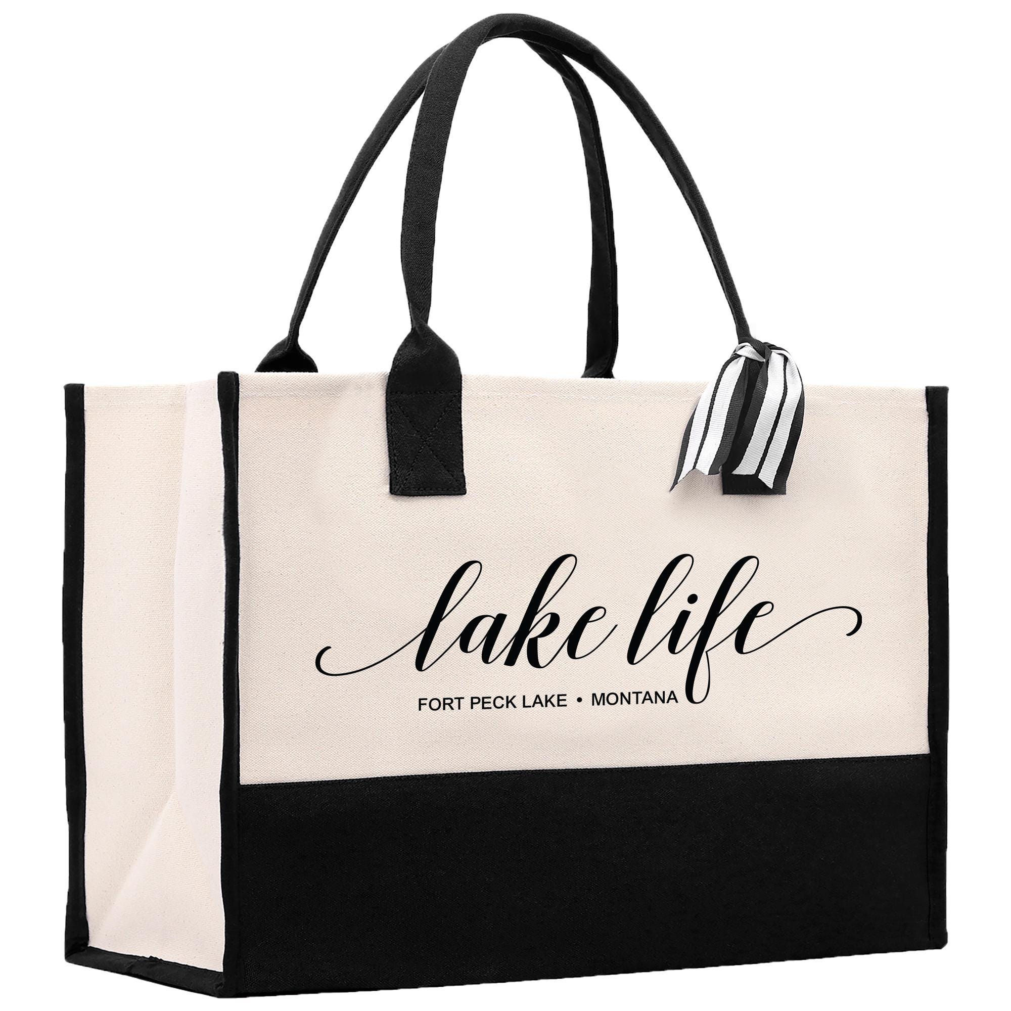 a black and white tote bag with the words lake life on it