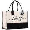 a black and white tote bag with the words lake life on it
