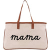 A beige canvas tote bag with the word "mama" printed in black cursive text.