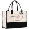 a black and white bag with a bow on it