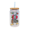 a glass jar with a straw in it