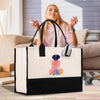 A woman is sitting on a couch, holding a phone, and a large tote bag with a perfume bottle design is placed in front of her.