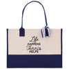 A tote bag with a blue and white color scheme, featuring a printed message on the front.