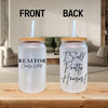a couple of plastic cups sitting on top of a wooden table