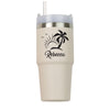 a white tumbler cup with a palm tree on it