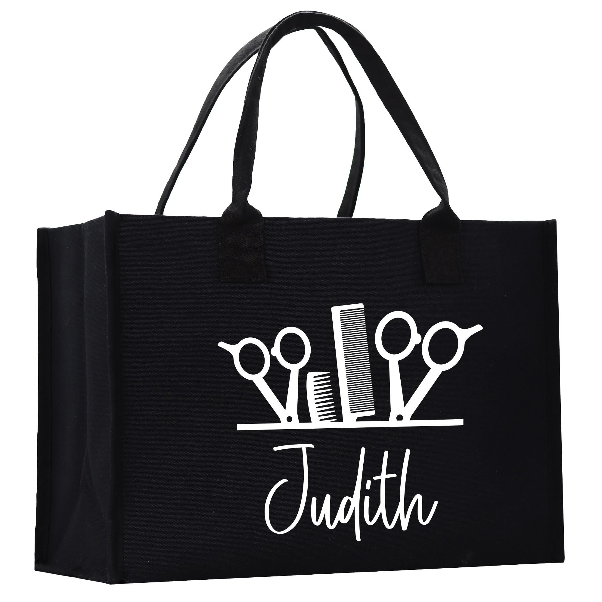 a black tote bag with scissors on it