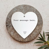 a heart shaped plaque with a message on it