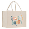 A beige canvas tote bag with the text "GROOY DADDY" printed on it.