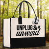A black and white tote bag with the text 