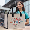 a woman holding a shopping bag with the word nurse on it