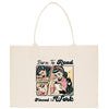 a tote bag with a picture of a woman reading a book