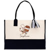 a black and white bag with a picture of a cup of coffee