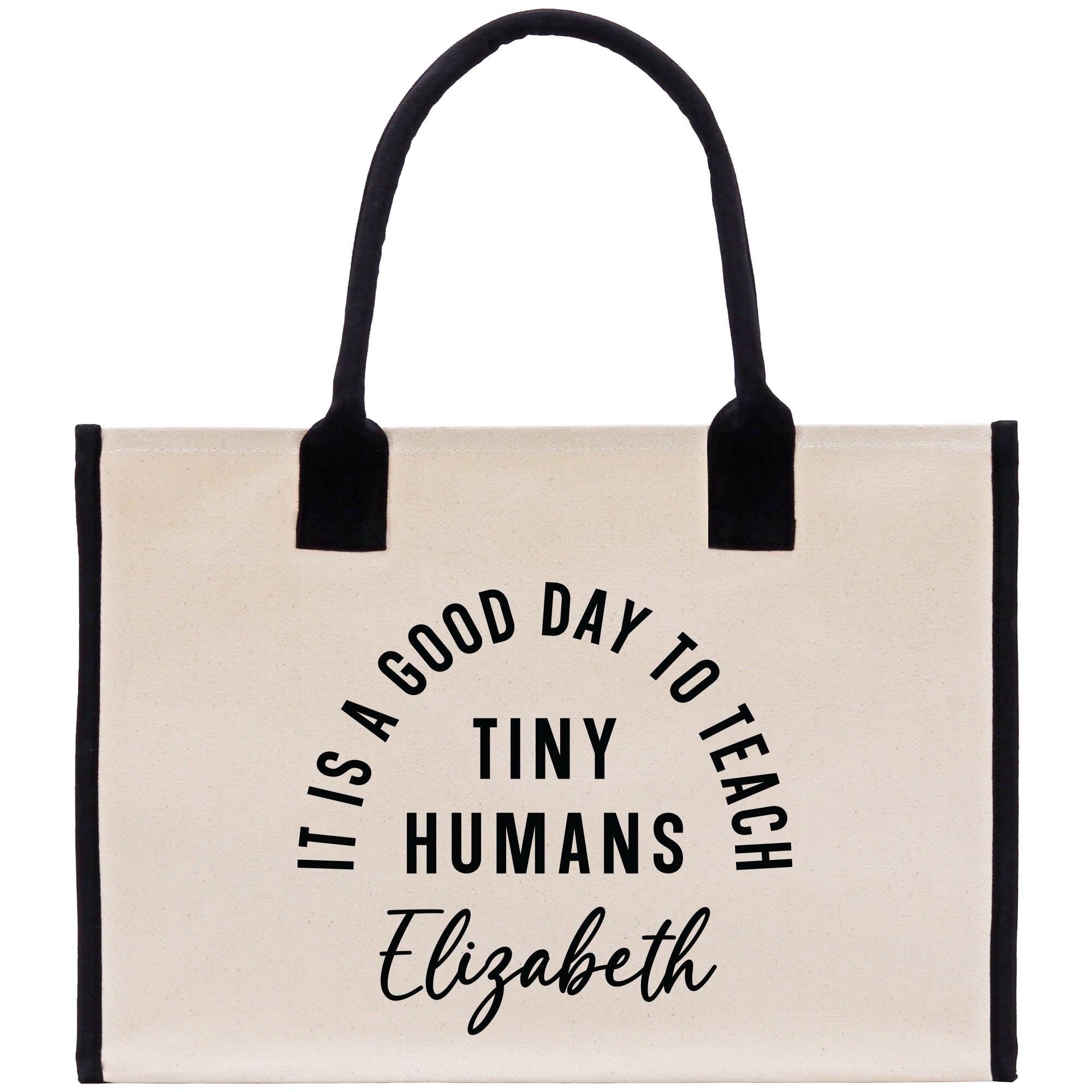 a white bag with a black handle that says it&#39;s a good day to