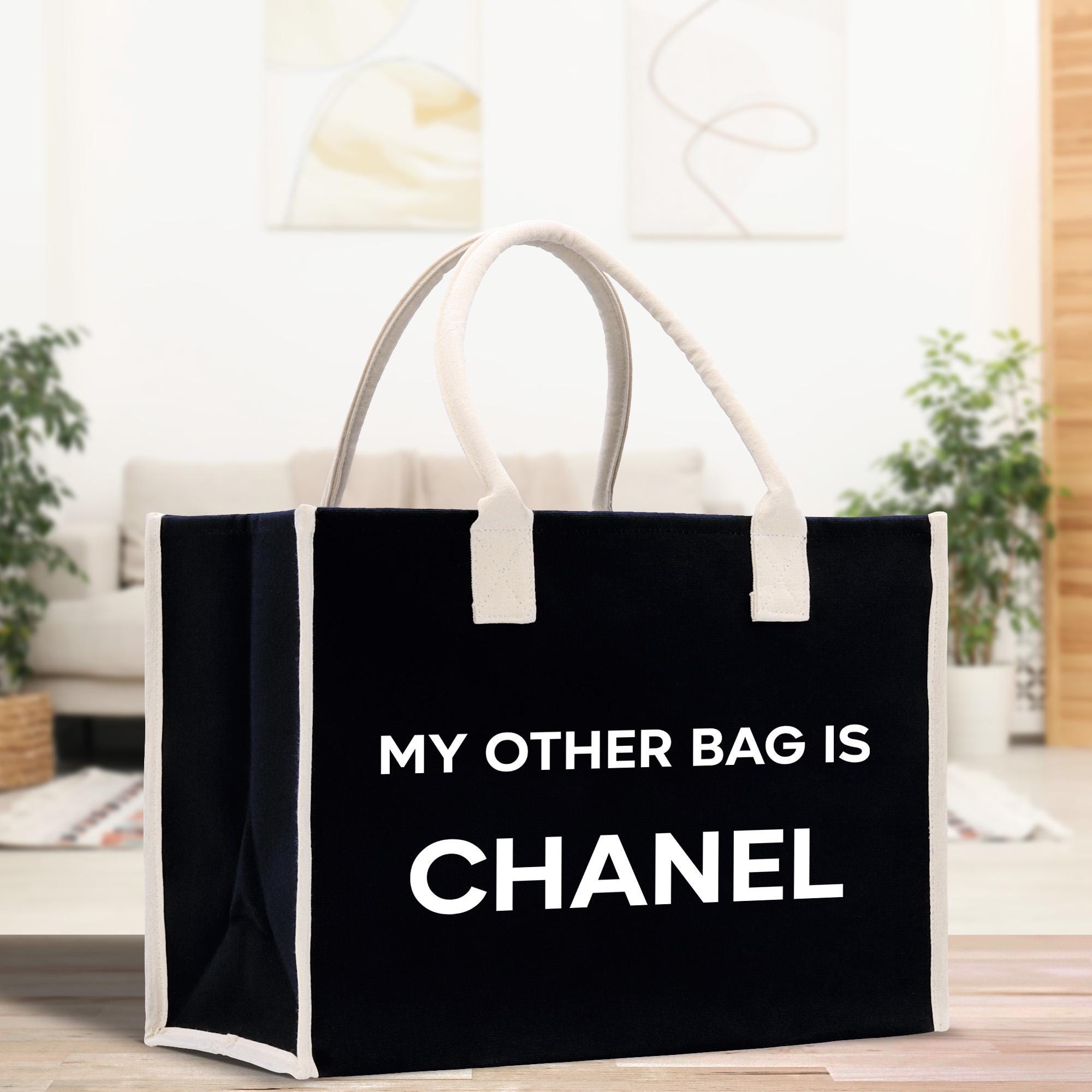 a black and white bag that says, my other bag is chanel