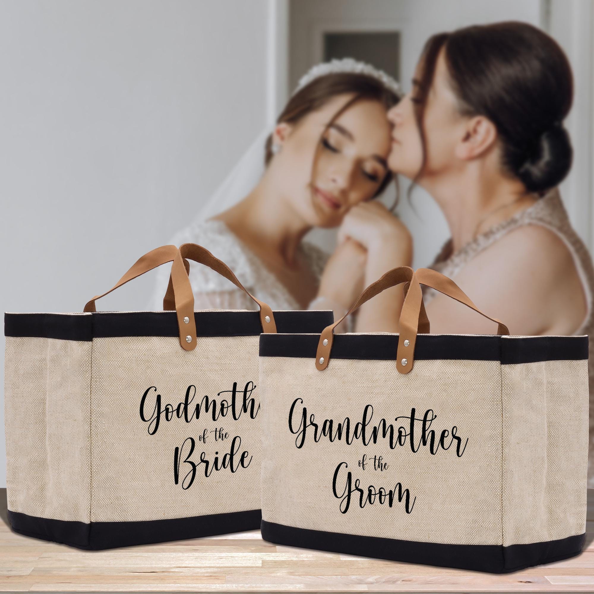 a bride and groom kissing in front of a canvas bag