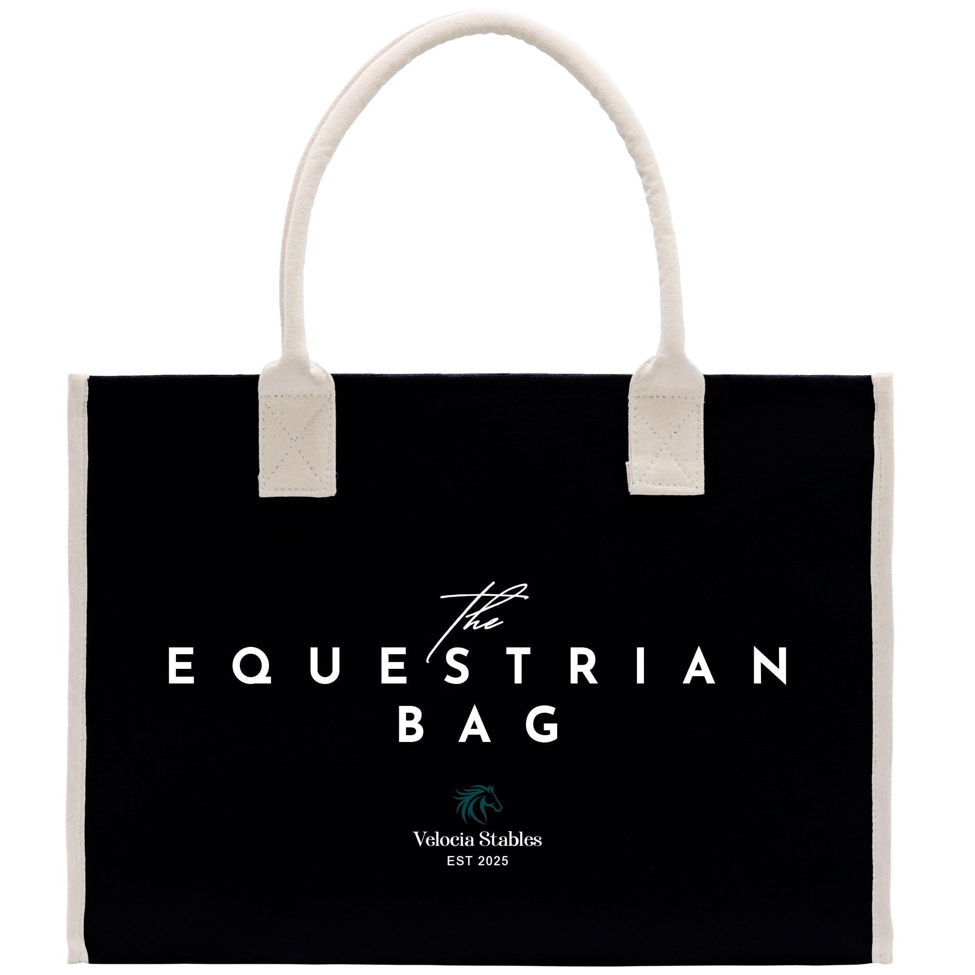 a black bag with white trim and the text &quot;The Equestrian Bag&quot; printed on it.