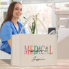 a woman sitting at a table with a medical bag