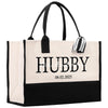 a black and white tote bag with a name tag