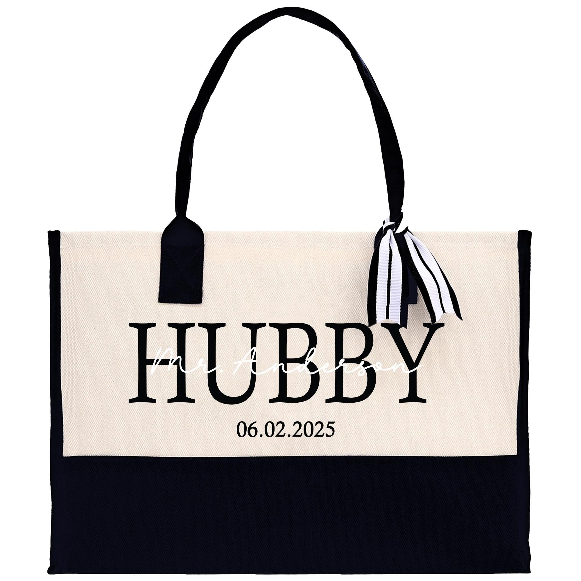 a black and white tote bag with a name tag