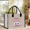 a white bag with a cassette print on it