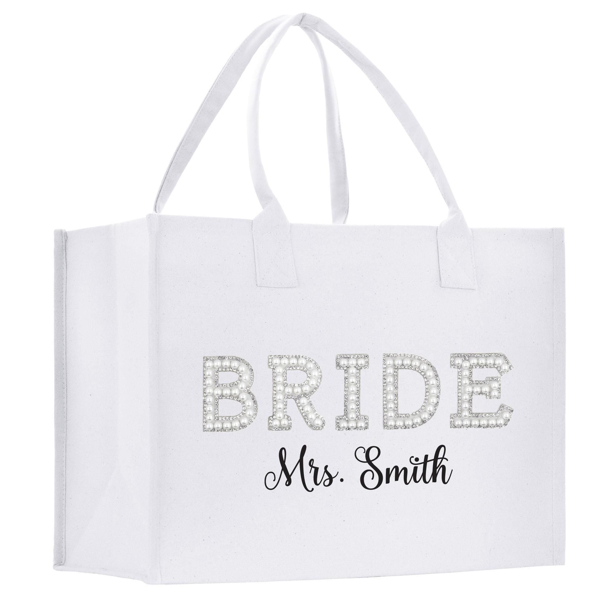 A white tote bag with the text &quot;BRIDE&quot; and &quot;Mrs. Smith&quot; printed on it.