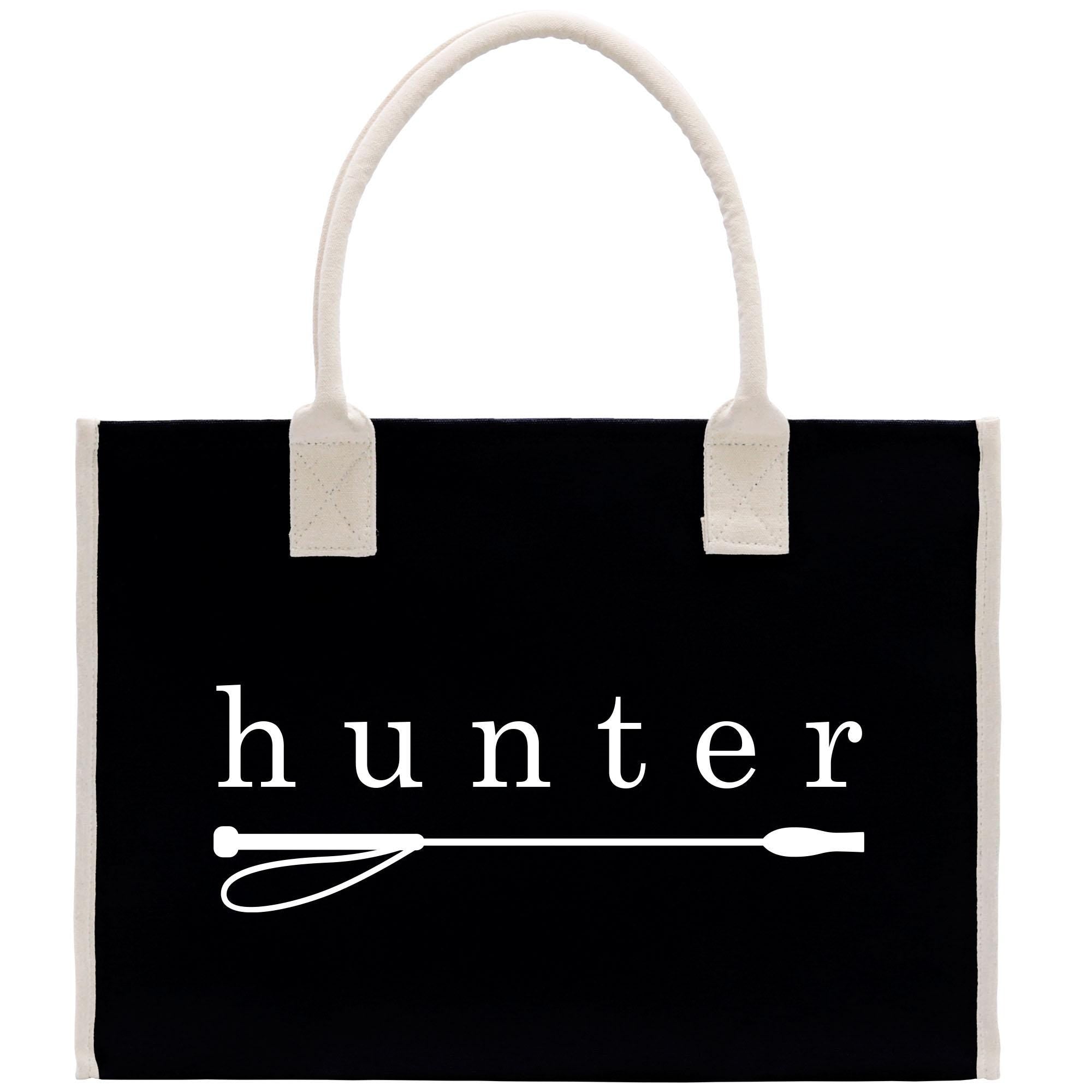A black tote bag with the word &quot;hunter&quot; printed on it in white text.