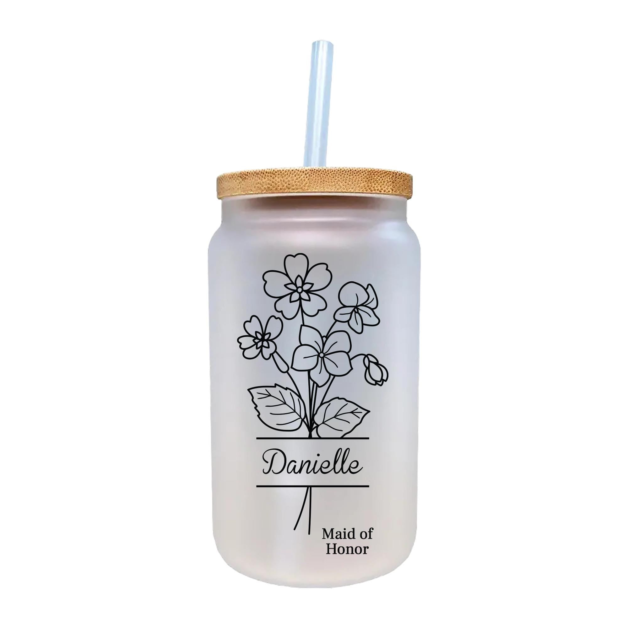a glass jar with a straw in it