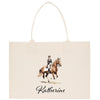 A beige tote bag with a printed image of a person riding a horse on it.