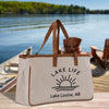 a lake life tote bag sitting on a dock