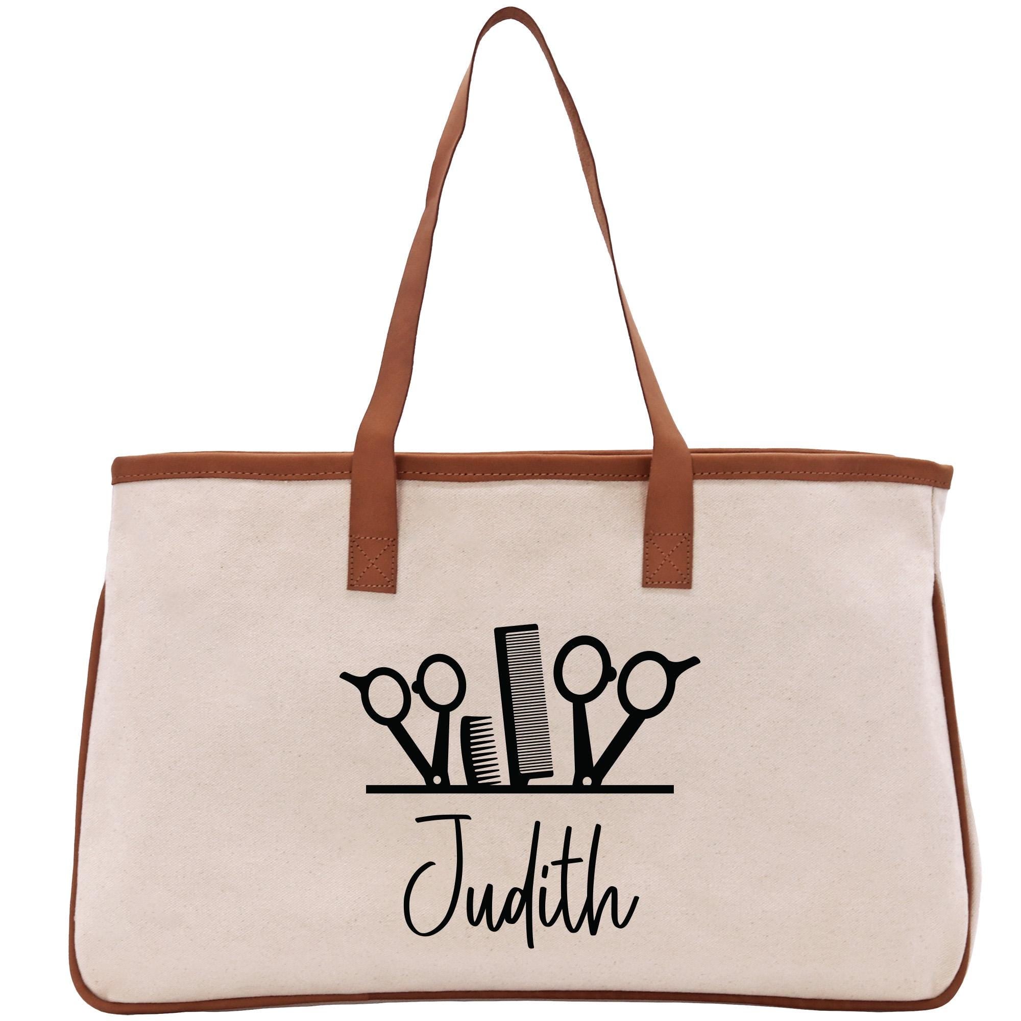 a tote bag with scissors and a name on it