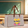 a bag with a bow on it sitting on a table