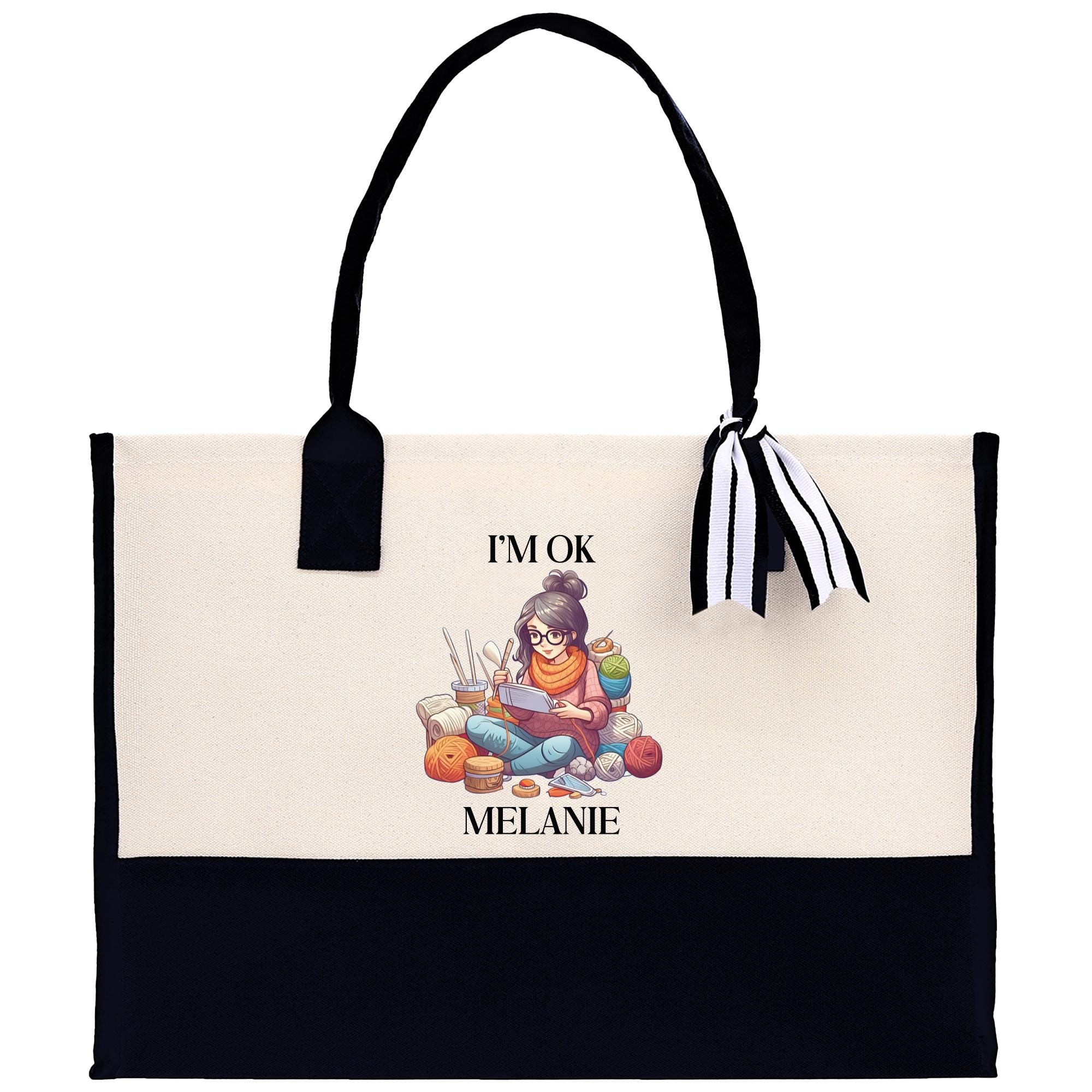 a black and white tote bag with a picture of a girl reading a book