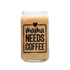 a glass jar filled with liquid that says mama needs coffee