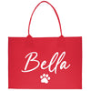 a red shopping bag with a dog's paw on it