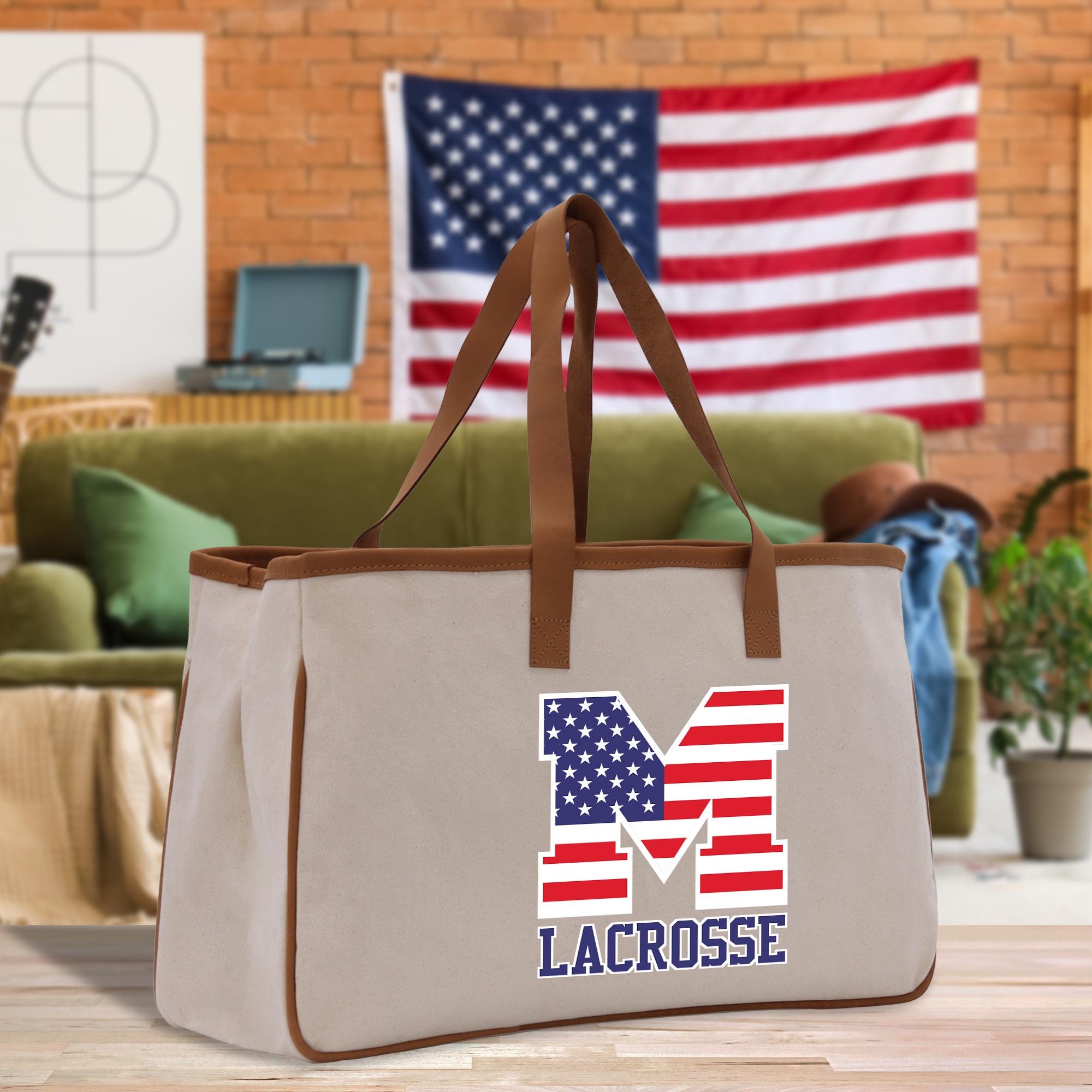 a large canvas bag with the letter m on it