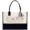 a black and white bag with a bow on it