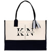 A black and white tote bag with the text "Kathy Nelson" printed on it.