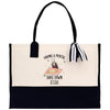 a black and white bag with a tassel hanging from it