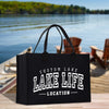 a black lake life bag sitting on a dock