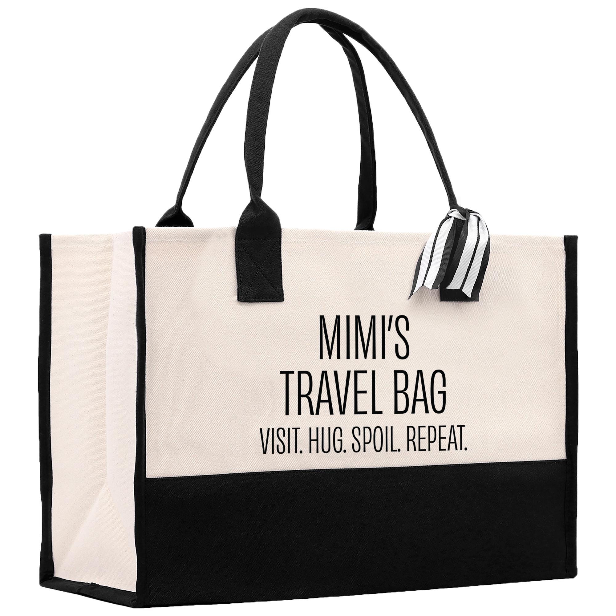 a black and white bag with a black handle