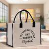 a white bag with a black handle that says it's a good day to