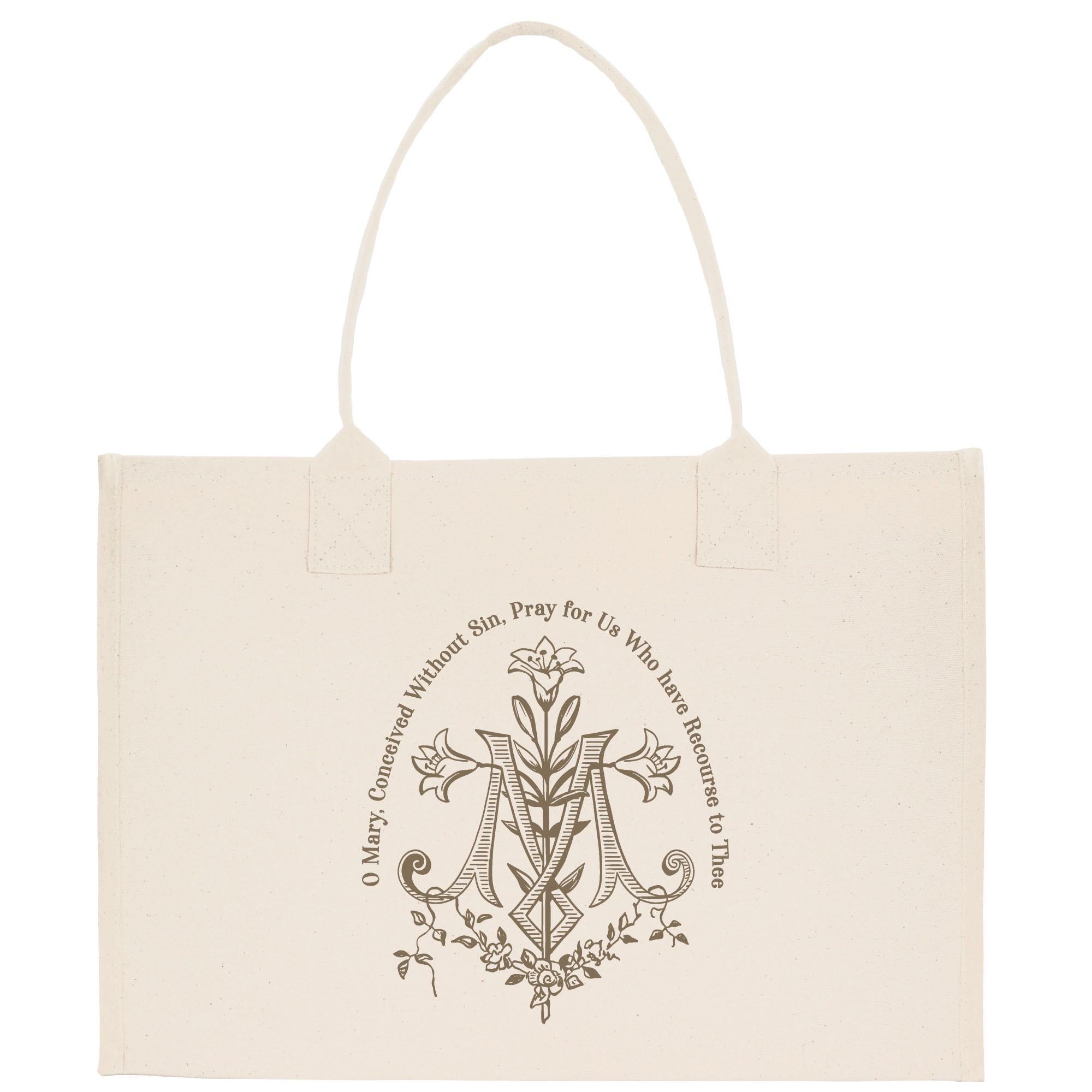 A beige canvas tote bag with a decorative monogram and text printed on it.