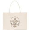 A beige canvas tote bag with a decorative monogram and text printed on it.