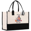 a black and white tote bag with a cartoon character