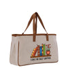 A beige canvas tote bag with a printed design of a bookshelf and flowers, along with the text "I HAVE NO SHELF CONTROL".