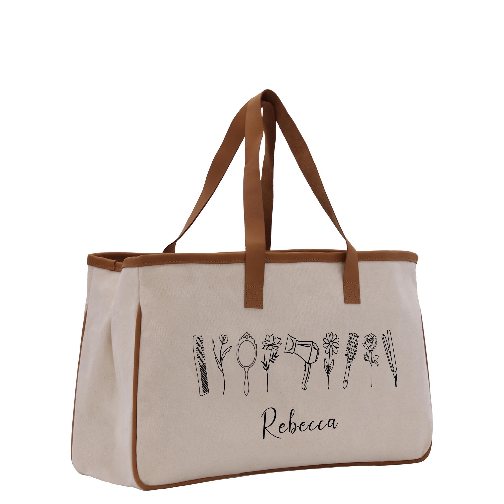 A beige canvas tote bag with a brown handle and straps, featuring a line of stylized hair and beauty-related icons printed on it.
